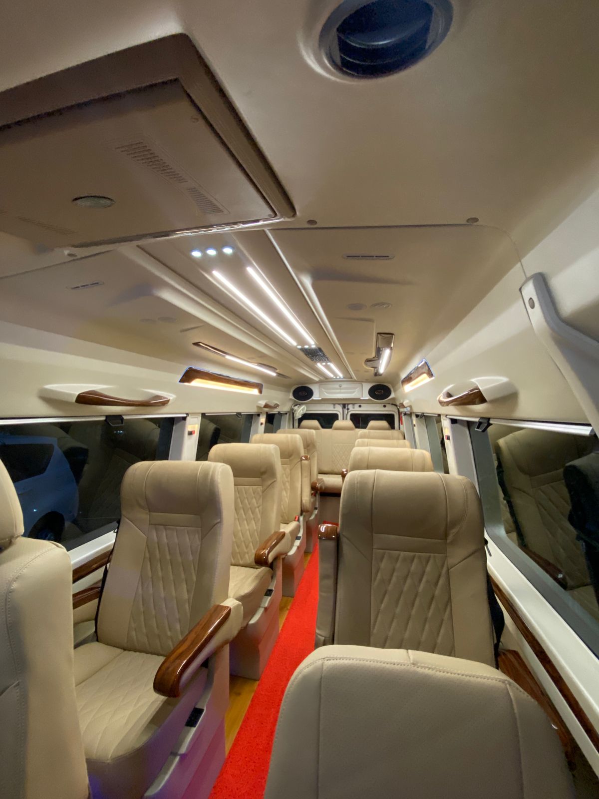 Comfortable passenger seats inside a Tempo Traveller